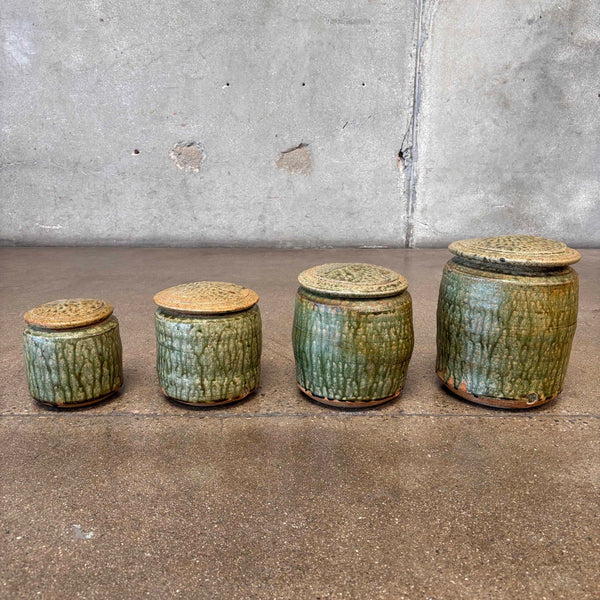 Set of Four Apothecary Jars With Lids