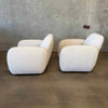 Pair of Vereien Modernist Swivel Chairs in Ivory Boucle