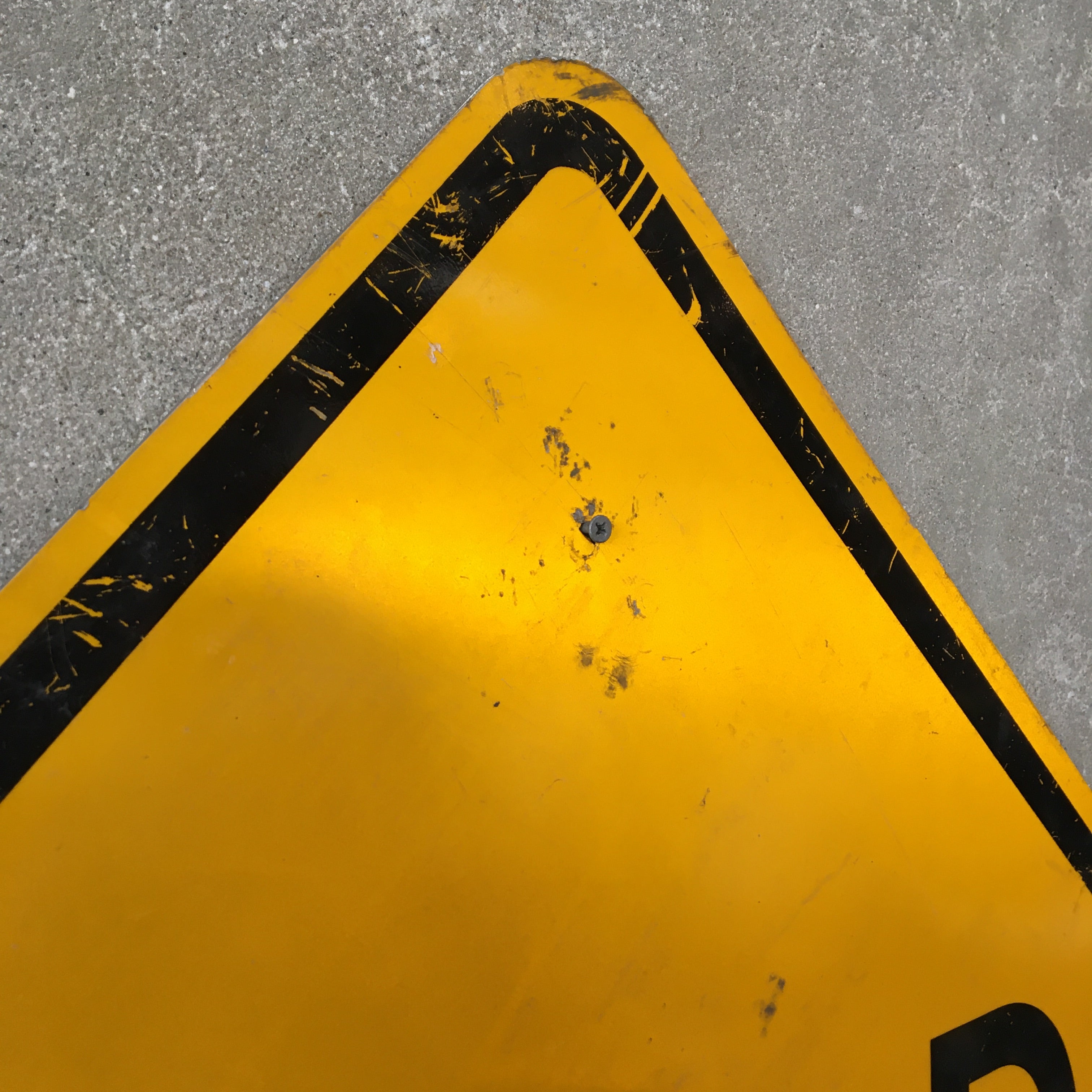 Yellow Triangle Street Sign