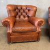 Pair of Distressed Leather Tufted Chairs