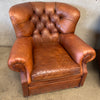 Pair of Distressed Leather Tufted Chairs