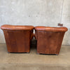Pair of Distressed Leather Tufted Chairs