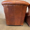 Pair of Distressed Leather Tufted Chairs