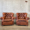Pair of Distressed Leather Tufted Chairs