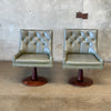 Pair of Mid Century Walnut Swivel Chairs with Vinyl Upholstery - As Is