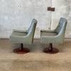 Pair of Mid Century Walnut Swivel Chairs with Vinyl Upholstery - As Is