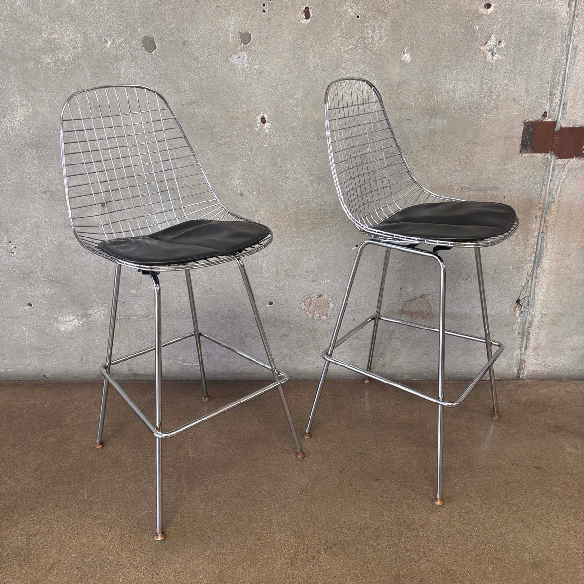 Pair of Herman Miller Eames Wire Stools w/ Black Cushions