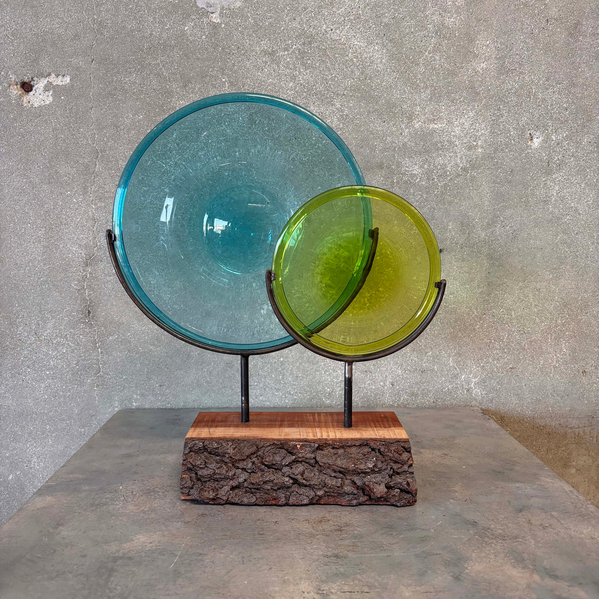Blown Glass Disc Sculpture on Redwood