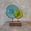 Blown Glass Disc Sculpture on Redwood