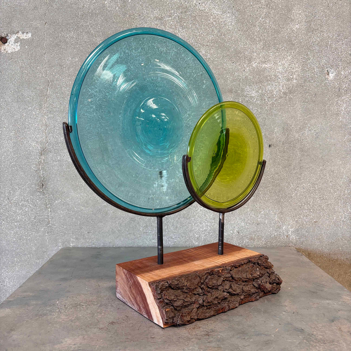 Blown Glass Disc Sculpture on Redwood