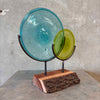 Blown Glass Disc Sculpture on Redwood