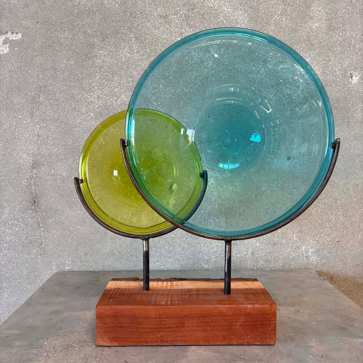 Blown Glass Disc Sculpture on Redwood