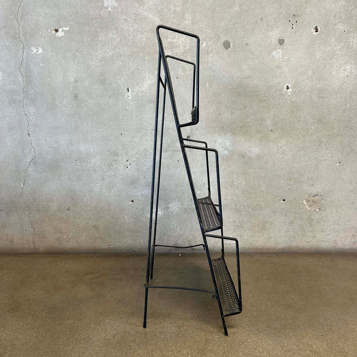 1950s Iron Magazine Rack - Folding Back Leg