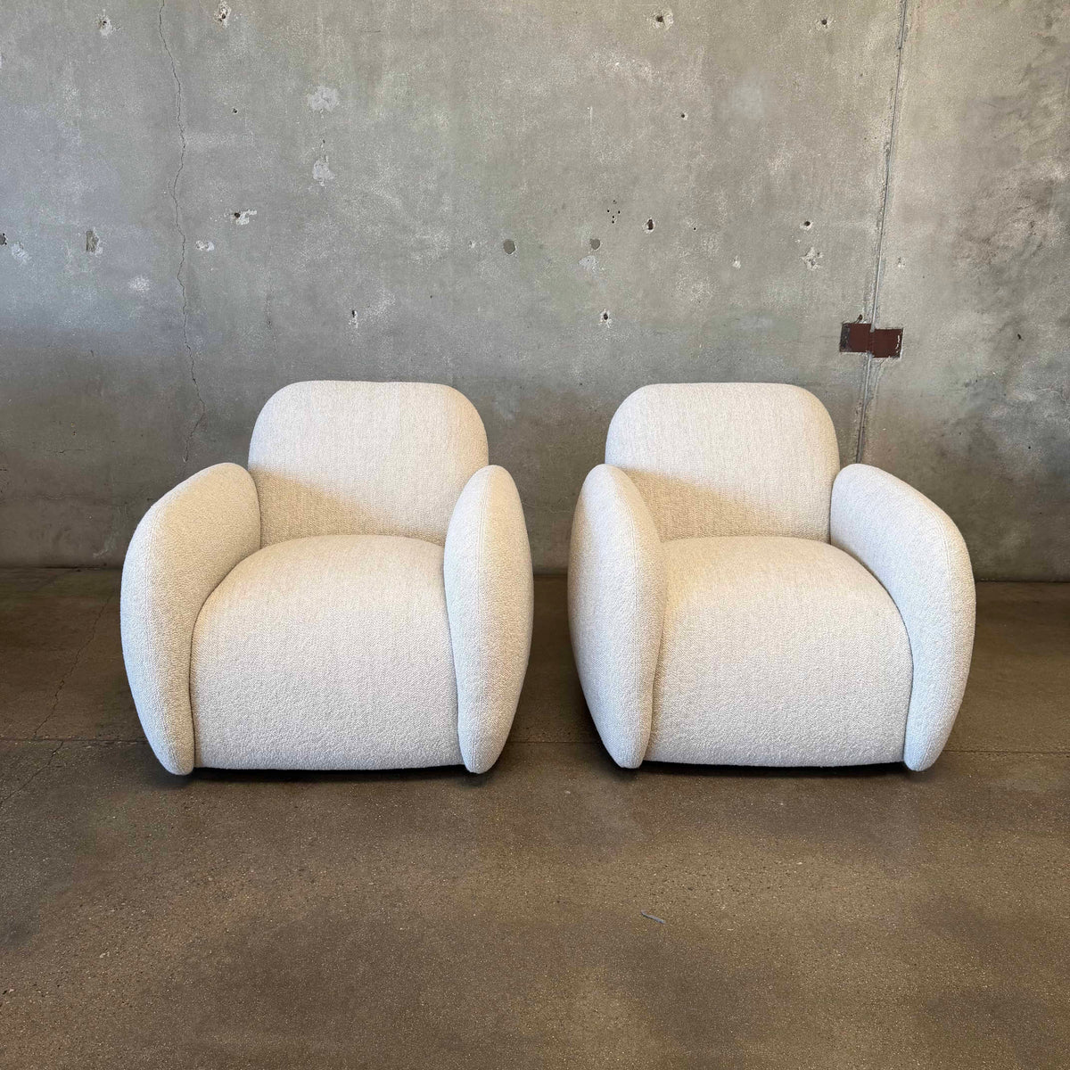 Pair of Vereien Modernist Swivel Chairs in Ivory Boucle