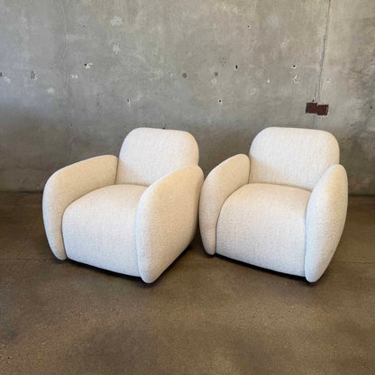 Pair of Vereien Modernist Swivel Chairs in Ivory Boucle