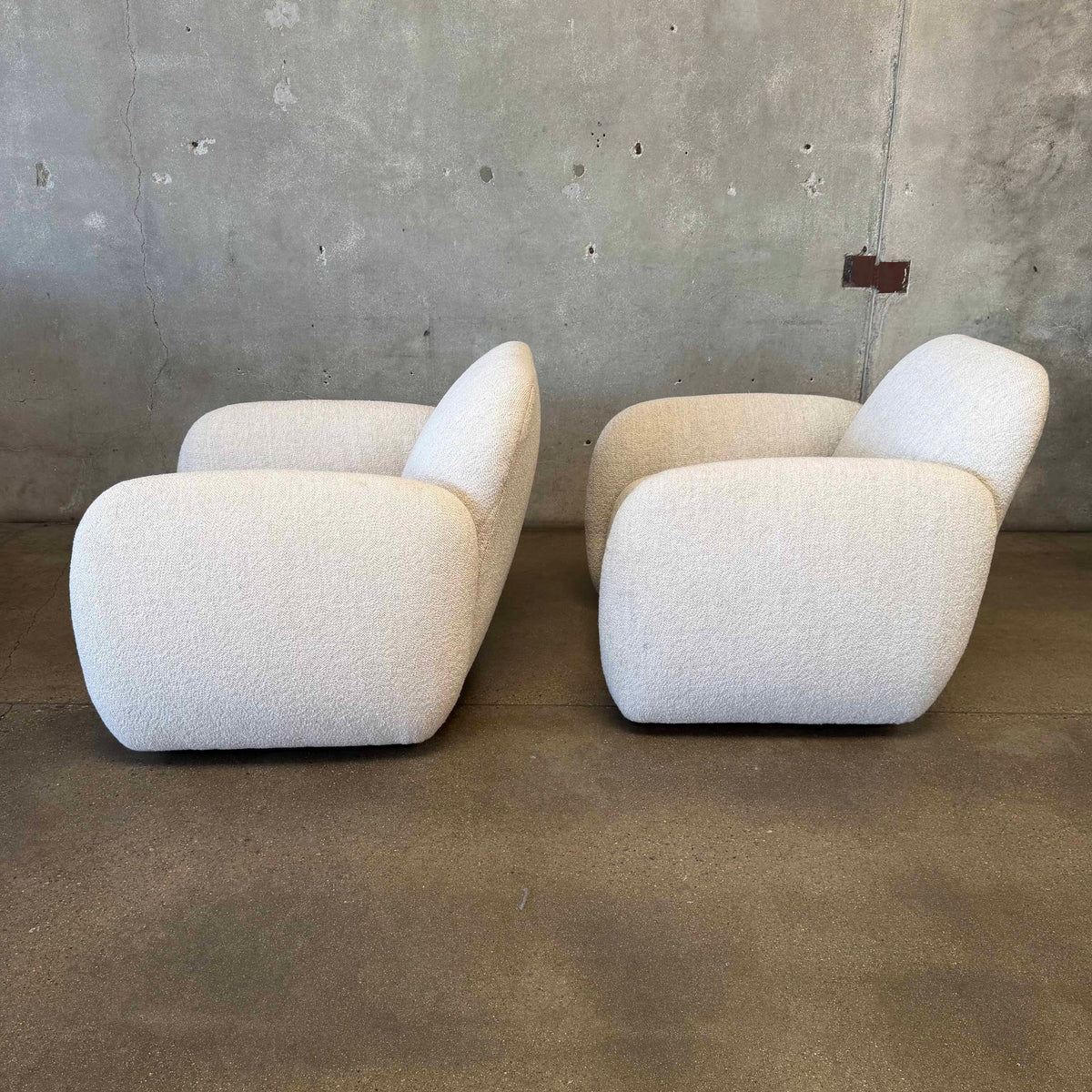 Pair of Vereien Modernist Swivel Chairs in Ivory Boucle