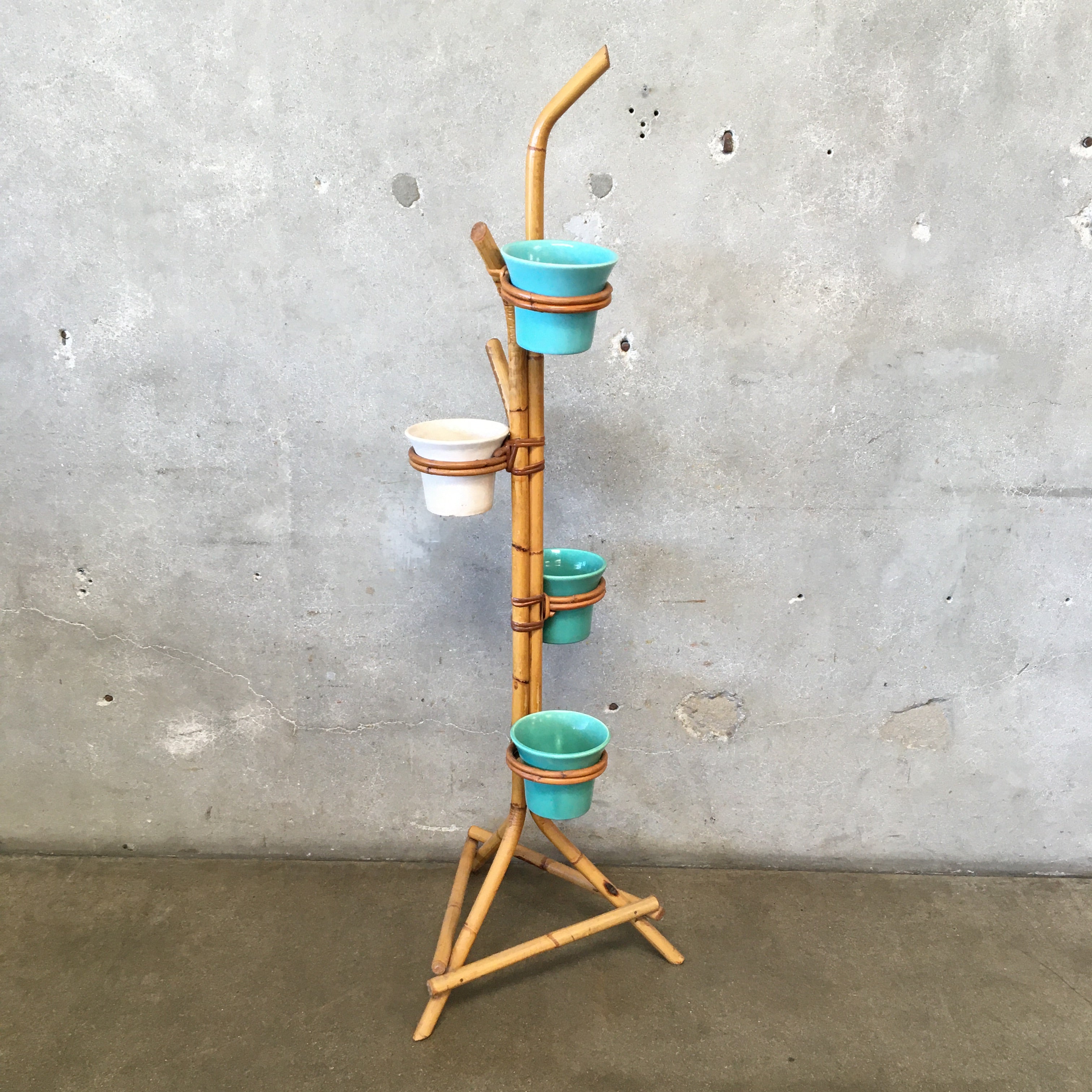 rattan pot plant holders 1940s-1950s Rattan Plant Stand with Four Bauer Pots
