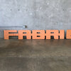 Vintage Industrial Iron Sign "Fabrication"